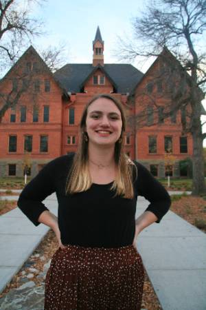 Andromeda Abarr standing in front of Montana Hall