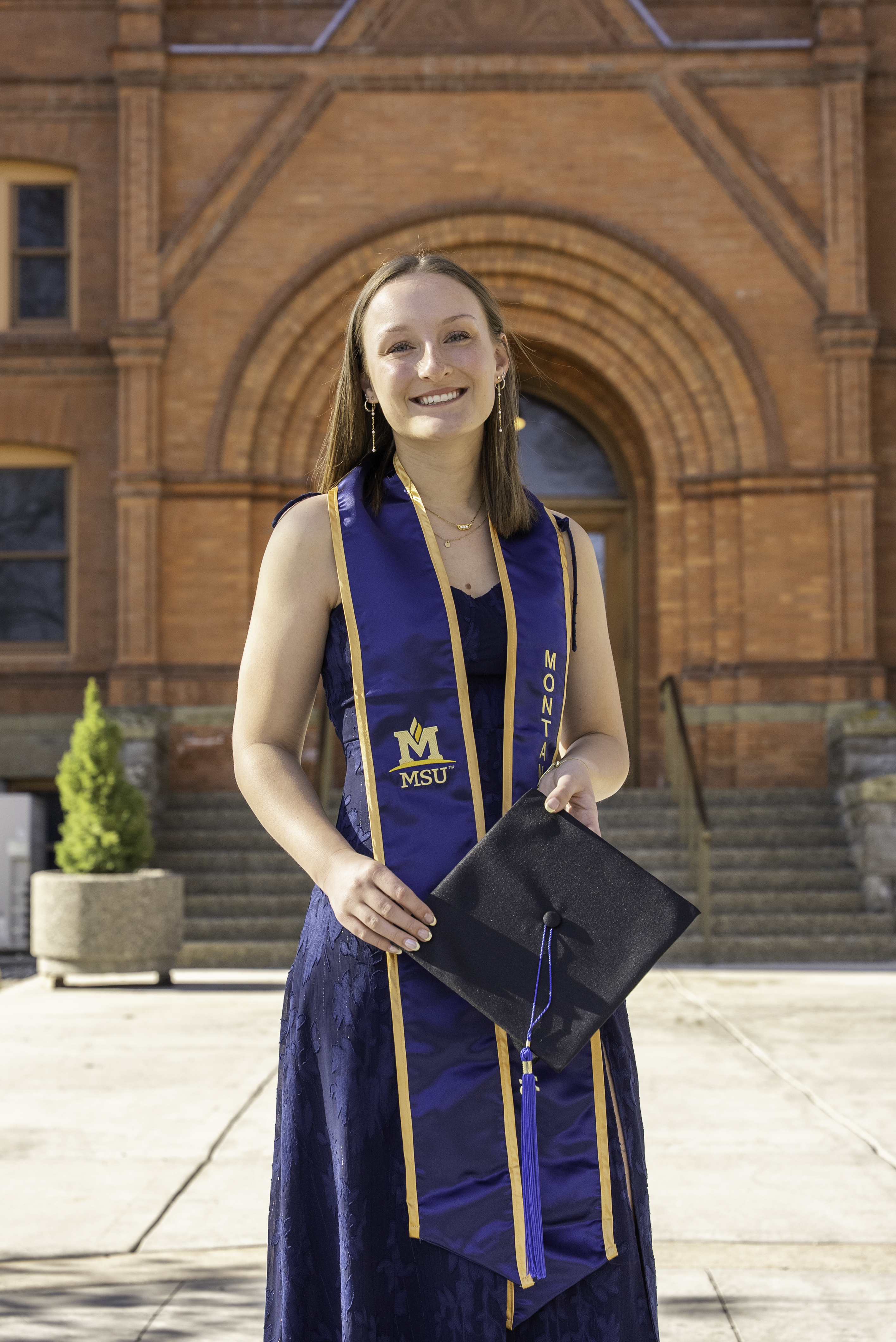 Emily H Grad Photo in front of Montana Hall