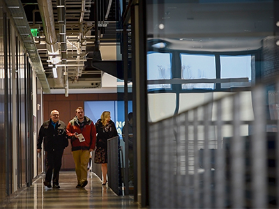 Students walking down a hallway.