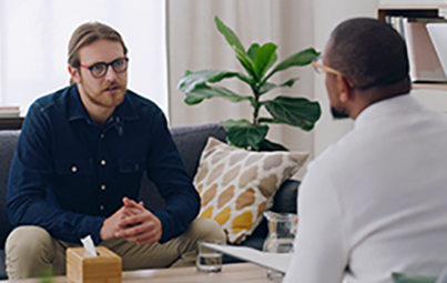 man talking with counselor