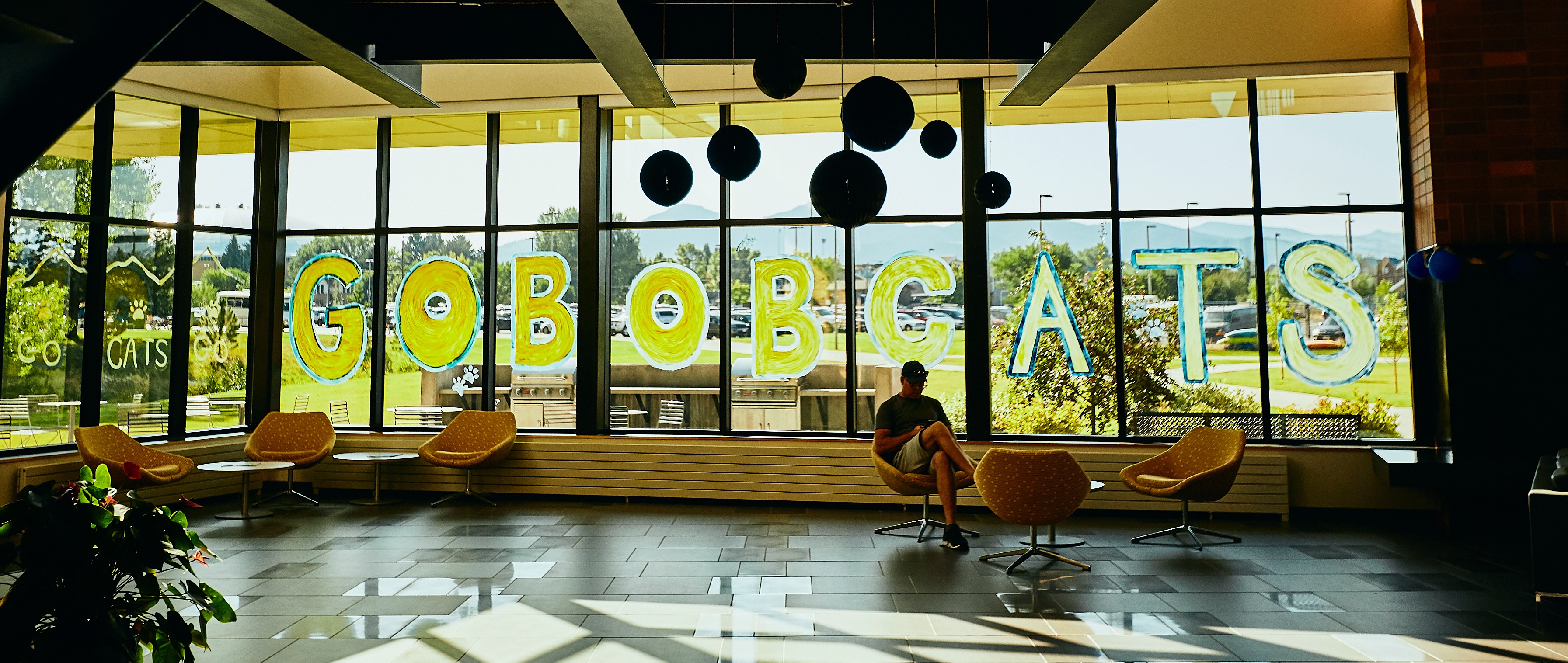 Go Bobcats written on dorm lobby window