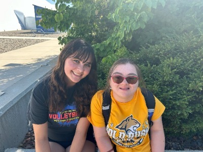 katelynn and chloe sitting outside