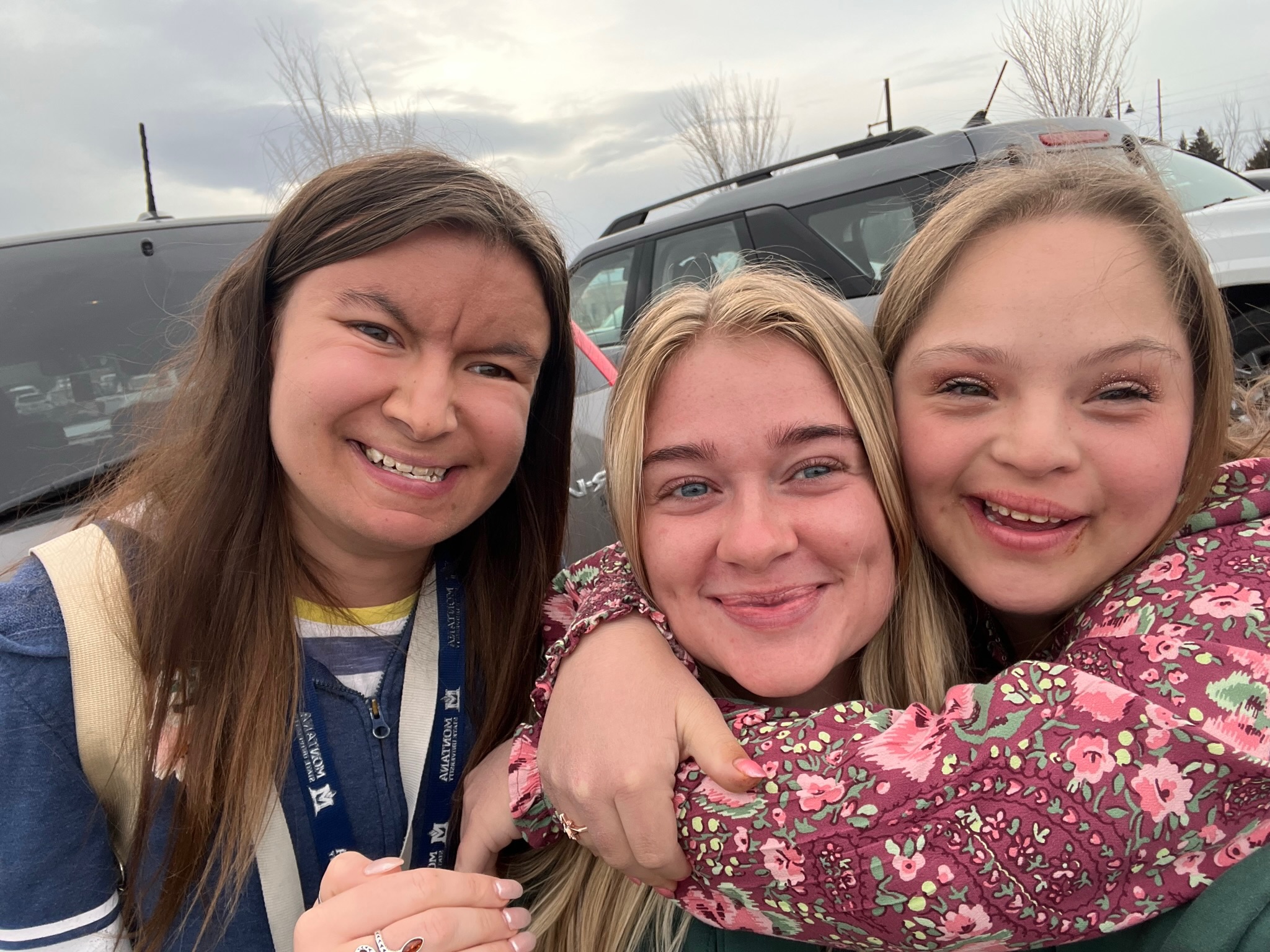 Three LIFE Scholars students hugging