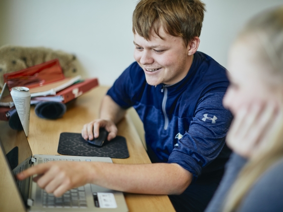 Jack at a computer with a peer partner