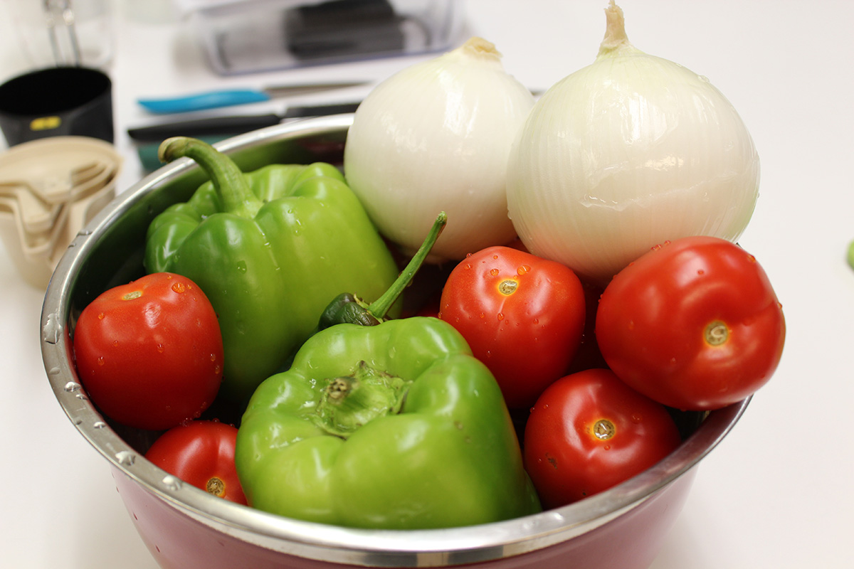 Onions, peppers, and tomatoes waiting to be preserved