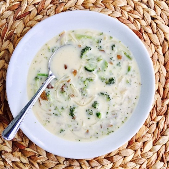 A bowl of broccoli potato soup.