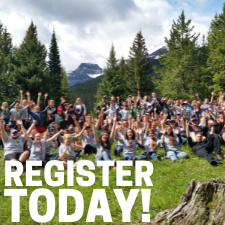 camp group photo with mountains