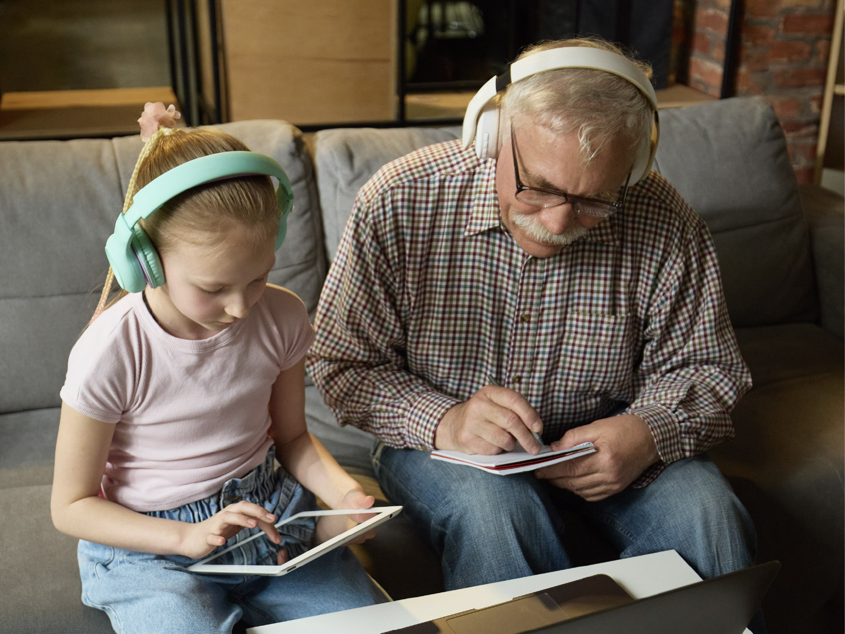 Grandfather and child researching on internet