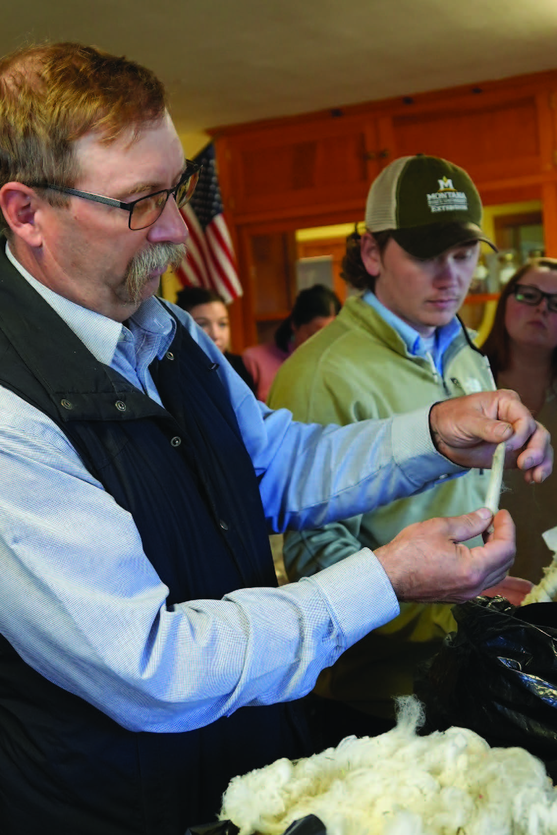 a man is demonstrating a test done to the wool