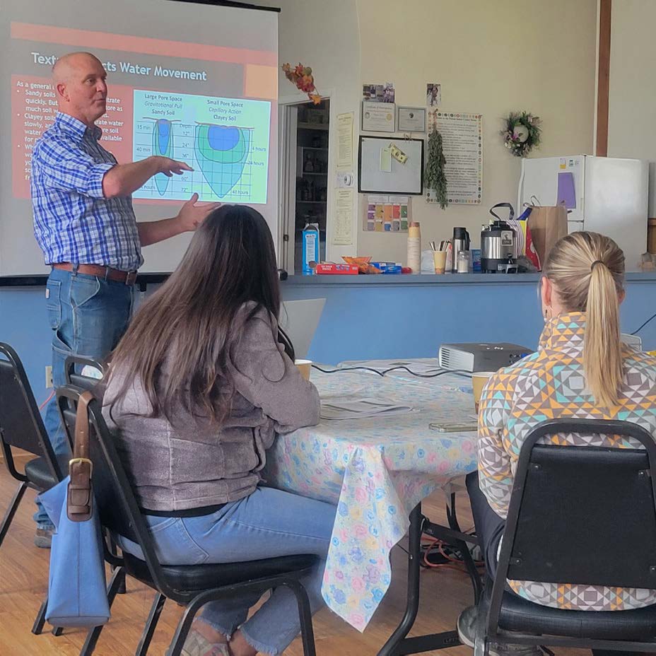 A volunteer leader teaching a master gardener class