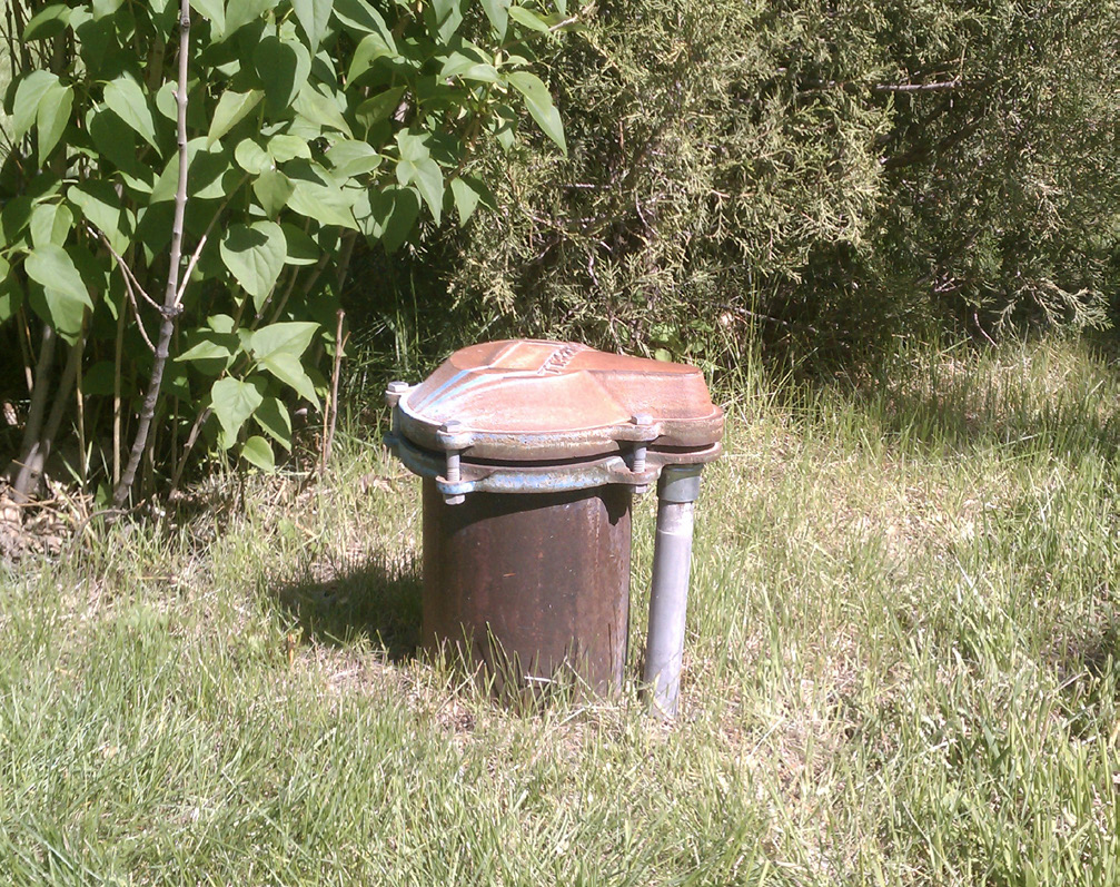 a well sticking up out of the ground