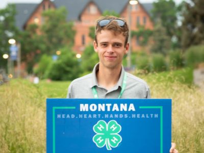4-H members using a parachute at camp