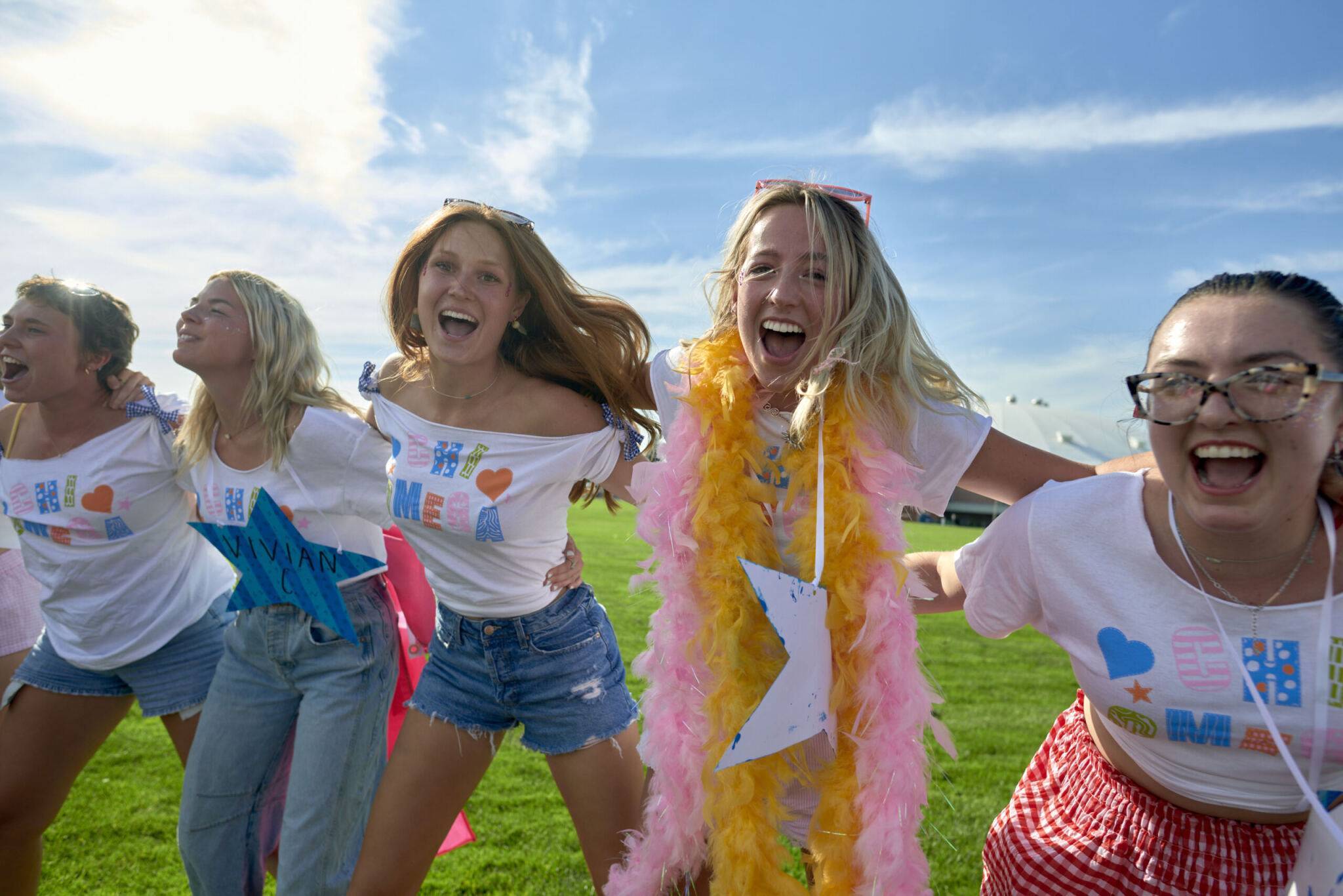 Happy students embracing their new sorority sisters