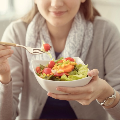 woman eating veggies