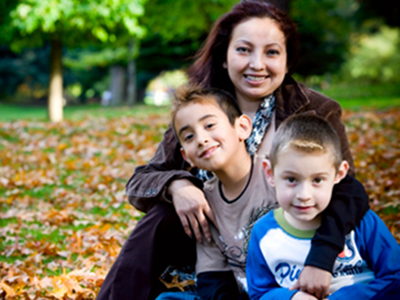 family sitting in leaves
