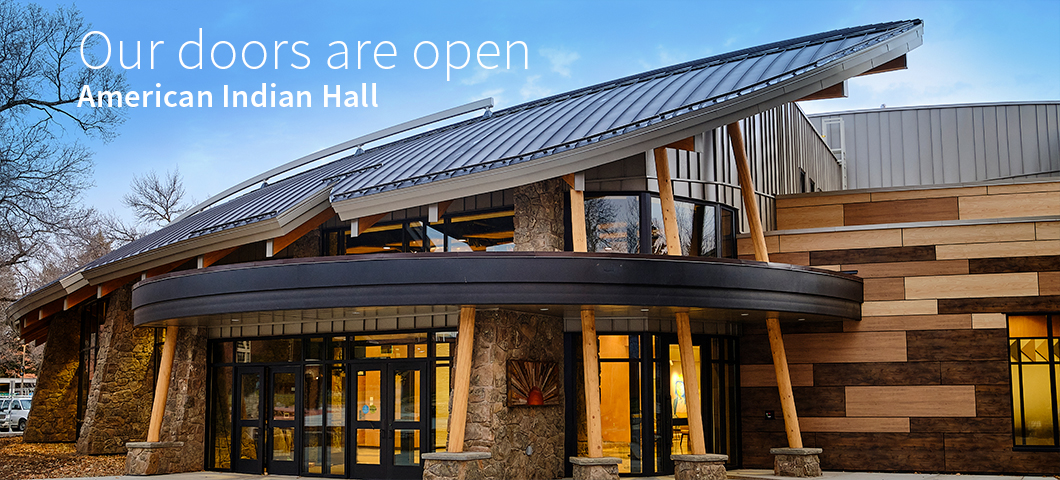 Image of the front of the American Indian Hall, with text stating "Our Doors are Open; American Indian Hall."