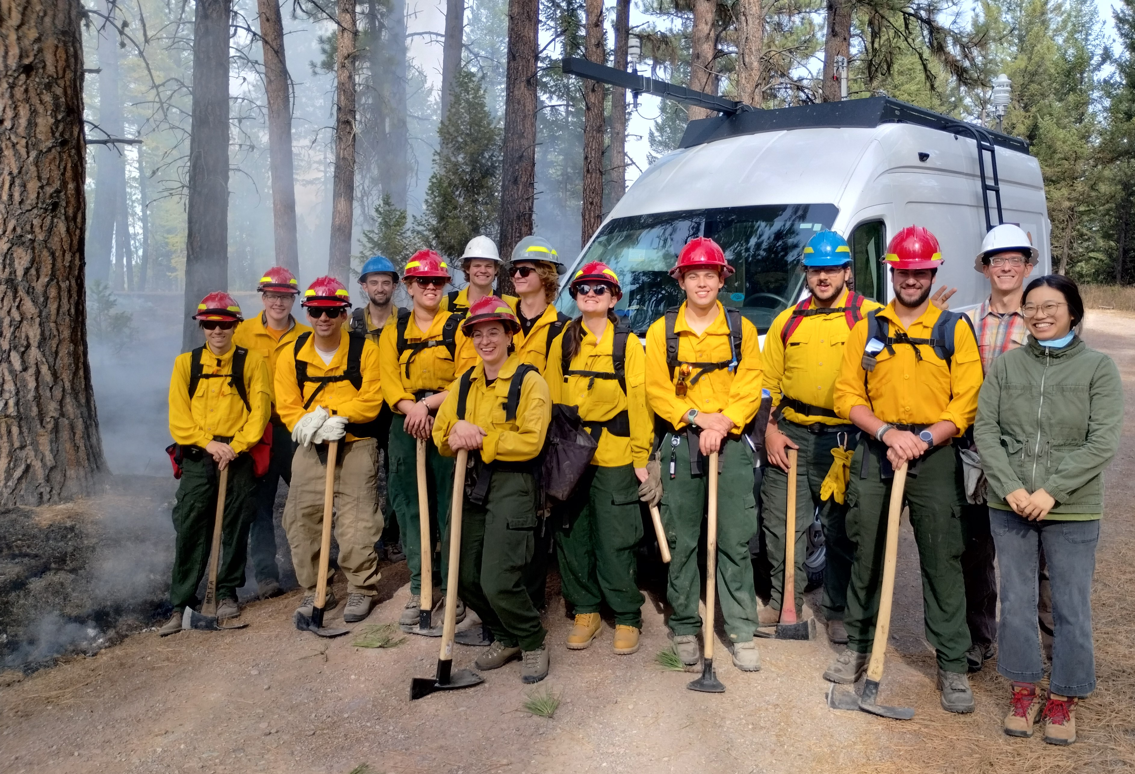 Fire team poses with mobile van laboratory