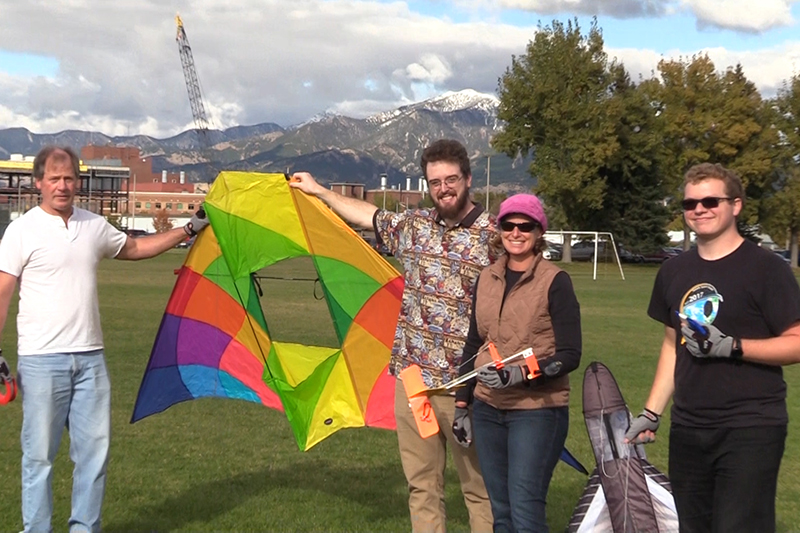 people holding a kite