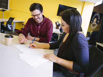 A student tutoring another student