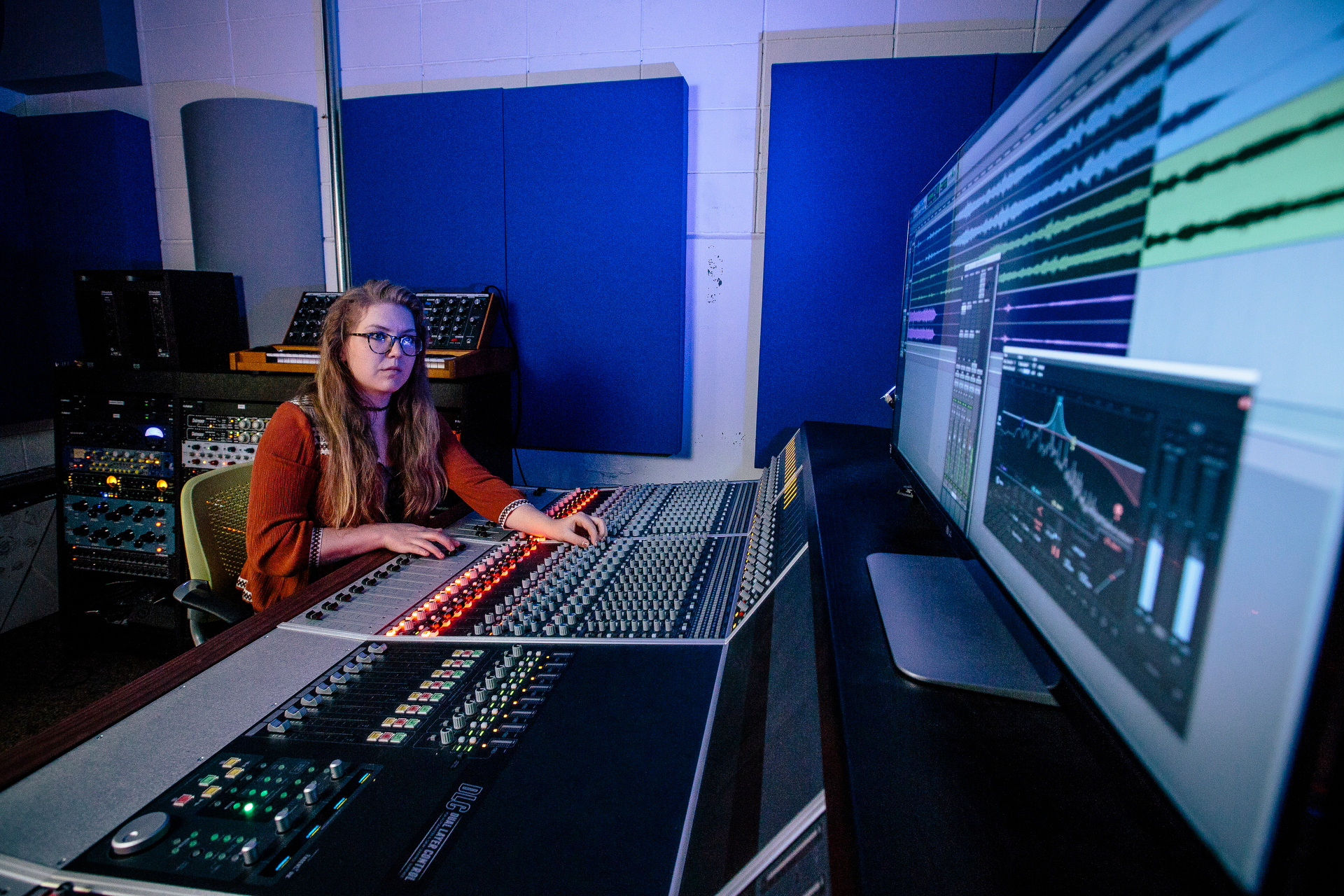 Music technology student at an electronic board