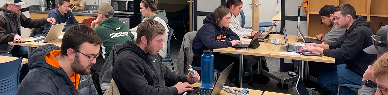 classroom of students sitting at tables